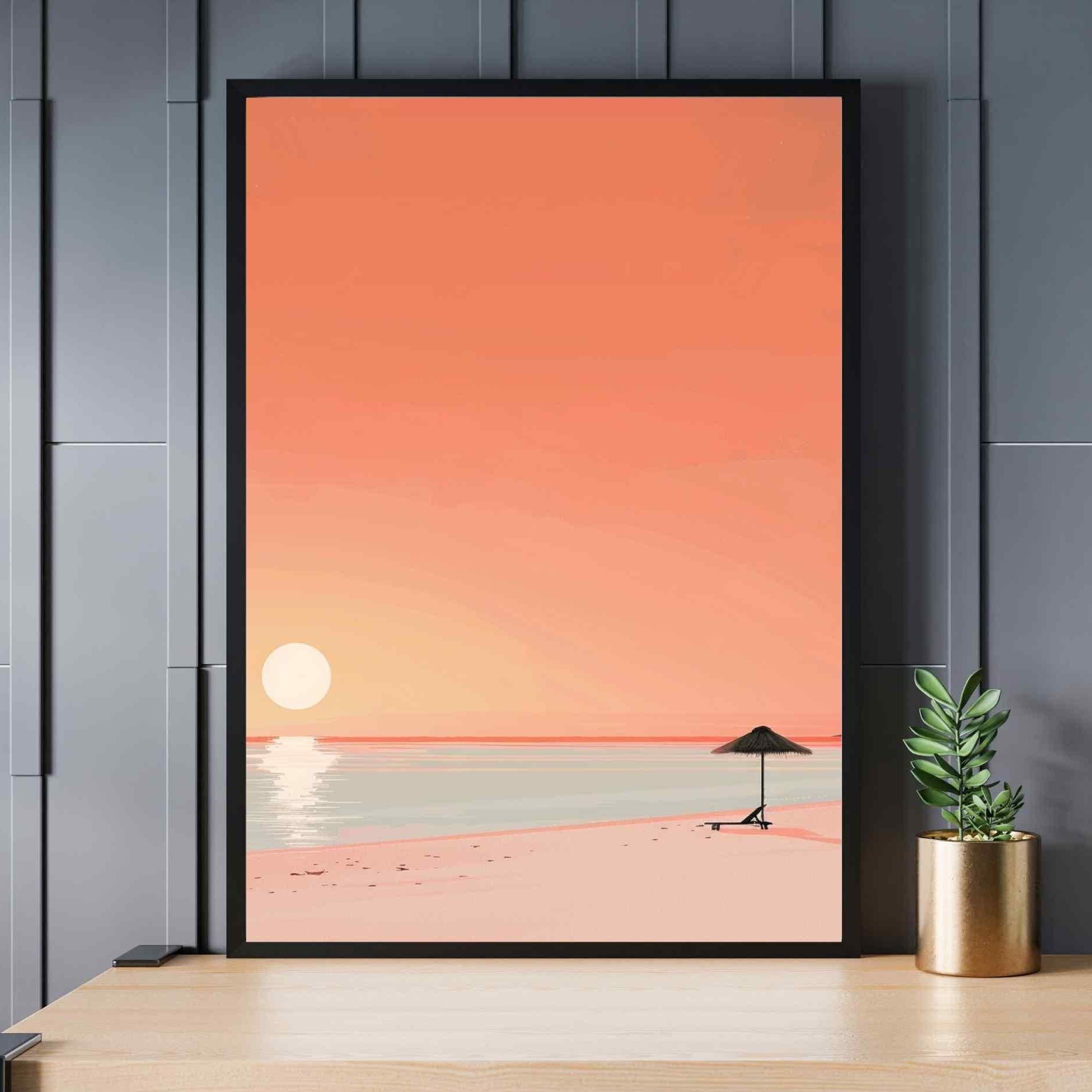 Framed artwork of a beach scene with a sunset on a wall above a desk.